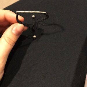 Trendy drawstring bracelet with rhinestone detail